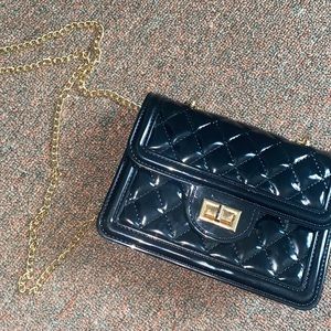 Small gold chained black purse